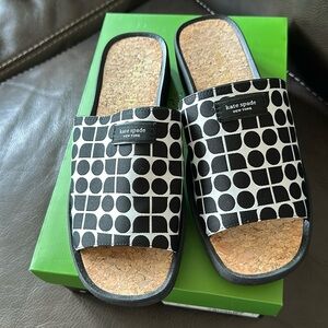 Kate Spade spree slides with Kate spade logo .